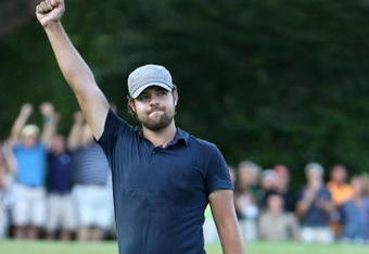 GREENSBORO, NC - AUGUST 23:  Ryan Moore celebrates after making a putt to win the Wyndham Championship in a sudden death playoff against Kevin Stadler and Jason Bohn at Sedgefield Country Club on August 23, 2009 in Greensboro, North Carolina  (Photo by Streeter Lecka/Getty Images)