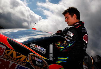 BRISTOL, TN - AUGUST 21:  Jeff Gordon, driver of the #24 DuPont Chevrolet, climbs into his car during practice for the NASCAR Sprint Cup Series Sharpie 500 at Bristol Motor Speedway on August 21, 2009 in Bristol, Tennessee.  (Photo by Jason Smith/Getty Images for NASCAR)