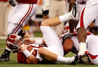 NEW ORLEANS - JANUARY 02:  Quarterback John Parker Wilson #14 of the Alabama Crimson Tide lays on his back after he was sacked in the second quarter while taking on the Utah Utes during the 75th Allstate Sugar Bowl at the Louisiana Superdome on January 2, 2009 in New Orleans, Louisiana.  (Photo by Chris Graythen/Getty Images)