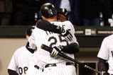 CHICAGO - SEPTEMBER 30:  Jim Thome #25 and Ken Griffey Jr. #17 of the Chicago White Sox celebrate after Thome hit a solo home run in the bottom of the seventh inning against the Minnesota Twins during the American League Central Division Tiebreaker game at U.S. Cellular Field on September 30, 2008 in Chicago, Illinois.  (Photo by Jamie Squire/Getty Images)