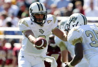 CHESTNUT HILL, MA - SEPTEMBER 20:  Michael Greco #2 of the Central Florida Knights hands the ball off to Ronnie Weaver #35 in the first half against the Boston College Eagles on September 20, 2008 at Alumni Stadium in Chestnut Hill, Massachusetts.  (Photo by Elsa/Getty Images)