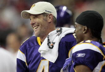 HOUSTON - AUGUST 31:  Quarterback Brett Favre #4 of the Minnesota Vikings shares a laugh wide receiver Jaymar Johnson #11 at Reliant Stadium on August 31, 2009 in Houston, Texas.  (Photo by Bob Levey/Getty Images)