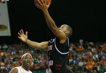ATLANTA - MARCH 14:  Devan Downey #2 of the South Carolina Gamecocks makes a shot over Wayne Chism #4 of the Tennessee Volunteers during the SEC Men's Basketball Tournament on March 14, 2008 at the Georgia Dome in Atlanta, Georgia.  (Photo by Chris Graythen/Getty Images)