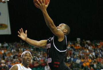 ATLANTA - MARCH 14:  Devan Downey #2 of the South Carolina Gamecocks makes a shot over Wayne Chism #4 of the Tennessee Volunteers during the SEC Men's Basketball Tournament on March 14, 2008 at the Georgia Dome in Atlanta, Georgia.  (Photo by Chris Graythen/Getty Images)