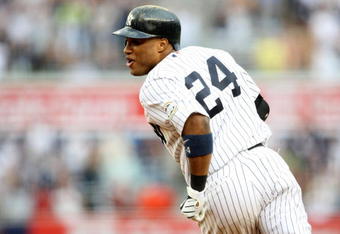 NEW YORK - AUGUST 12:  Robinson Cano #24 of the New York Yankees celebrates after hitting the game winning single against the Toronto Blue Jays during the MLB game on August 12, 2009 at Yankee Stadium in the Bronx borough of New York City.  The Yankees won 4-3 in 11 innings. (Photo by Nick Laham/Getty Images)