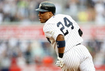 NEW YORK - AUGUST 12:  Robinson Cano #24 of the New York Yankees celebrates after hitting the game winning single against the Toronto Blue Jays during the MLB game on August 12, 2009 at Yankee Stadium in the Bronx borough of New York City.  The Yankees won 4-3 in 11 innings. (Photo by Nick Laham/Getty Images)