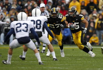 IOWA CITY, IA - NOVEMBER 8:  Runningback Paki O'Meara #25 of the Iowa Hawkeyes rushes for yards as his teammate Jewel Hampton #27 defends on the play against defenders Drew Astorino #28 and Kevin Kelly #23 of the Penn State Nittany Lions in the first quarter of play at Kinnick Stadium on November 8, 2008 in Iowa City, Iowa. Iowa defeated Penn State 24-23. (Photo by David K Purdy/Getty Images)