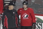 CALGARY, AB - AUGUST 24: Sidney Crosby talks with associate coach Lindy Ruff during the second practice of the Team Canada Olympic Orientation Camp on August 24, 2009 at the Pengrowth Saddledome in Calgary, Alberta, Canada. (Photo by Mike Ridewood/Getty Images)