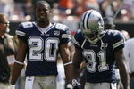 CLEVELAND - SEPTEMBER 7:  Alan Ball #20 and Mike Jenkins #31 of the Dallas Cowboys look on before the game against the Cleveland Browns at Cleveland Browns Stadium on September 7, 2008 in Cleveland, Ohio.  (Photo by Kevin C. Cox/Getty Images)