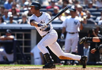 NEW YORK - AUGUST 30: Derek Jeter #2 of the New York Yankees hits a base hit against the Chicago White Sox during their game on August 30, 2009 at Yankee Stadium in the Bronx borough of New York City.  (Photo by Chris McGrath/Getty Images)