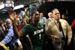 DETROIT - APRIL 04:  Kalin Lucas #1 of the Michigan State Spartans celebrates with fans as he walks off the court after their 82-73 win against the Connecticut Huskies during the National Semifinal game of the NCAA Division I Men's Basketball Championship at Ford Field on April 4, 2009 in Detroit, Michigan.  (Photo by Gregory Shamus/Getty Images)