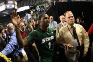 DETROIT - APRIL 04:  Kalin Lucas #1 of the Michigan State Spartans celebrates with fans as he walks off the court after their 82-73 win against the Connecticut Huskies during the National Semifinal game of the NCAA Division I Men's Basketball Championship at Ford Field on April 4, 2009 in Detroit, Michigan.  (Photo by Gregory Shamus/Getty Images)