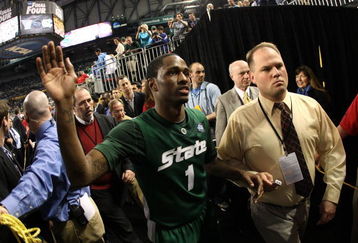 DETROIT - APRIL 04:  Kalin Lucas #1 of the Michigan State Spartans celebrates with fans as he walks off the court after their 82-73 win against the Connecticut Huskies during the National Semifinal game of the NCAA Division I Men's Basketball Championship at Ford Field on April 4, 2009 in Detroit, Michigan.  (Photo by Gregory Shamus/Getty Images)