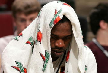 CHICAGO - MARCH 09:  Tyler Smith #34 of the Iowa Hawkeyes hangs his head on the bench in the final minutes of their the Purdue Boilermakers during the quarterfinals of the Big Ten Men's Basketball Conference Tournament March 9, 2007 at the United Center in Chicago, Illinois. Purdue won 74-55. (Photo by Jonathan Daniel/Getty Images)