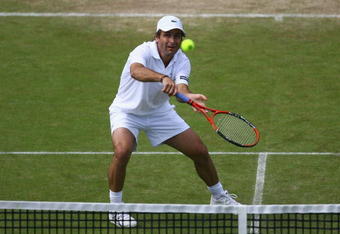 EASTBOURNE, ENGLAND - JUNE 19:  Fabrice Santoro of France plays a backhand in her match against Frank Dancevic of Canada during day five of the AEGON International on June 19, 2009 in Eastbourne, England.  (Photo by Julian Finney/Getty Images)