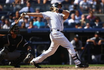 NEW YORK - AUGUST 30: Mark Teixeira #25 of the New York Yankees hits a three run homer in the seventh inning against the Chicago White Sox during their game on August 30, 2009 at Yankee Stadium in the Bronx borough of New York City.  (Photo by Chris McGrath/Getty Images)