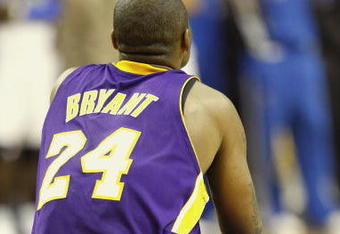 ORLANDO, FL - JUNE 14:  Kobe Bryant #24 of the Los Angeles Lakers rests for a moment in Game Five of the 2009 NBA Finals against the Orlando Magic on June 14, 2009 at Amway Arena in Orlando, Florida. The Lakers won 99-86.  NOTE TO USER:  User expressly acknowledges and agrees that, by downloading and or using this photograph, User is consenting to the terms and conditions of the Getty Images License Agreement. (Photo by Ronald Martinez/Getty Images) 