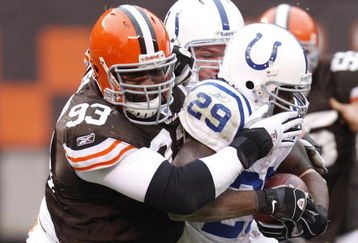 CLEVELAND - NOVEMBER 30: Louis Leonard #93 of the Cleveland Browns tackles Joseph Addai #29 of the Indianapolis Colts during a second quarter run on November 30, 2008 at Cleveland Browns Stadium in Cleveland, Ohio.  (Photo by Gregory Shamus/Getty Images)