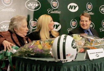 UNIONDALE, NY - JANUARY 17: Eric Mangini sits with his wife Julie (C) and mother Nancy during the press conference introducing him as the new head coach of the New York Jets on January 17, 2006 at the Jets Complex at Hofstra University in Uniondale, New York.  (Photo by Jim McIsaac/Getty Images)                 