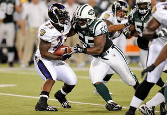 BALTIMORE - AUGUST 24:   Willis McGahee #23 of the Baltimore Ravens is tackled by Jamaal Westerman of the New York Jets during a preseason game at M&T Bank Stadium on August 24, 2009 in Baltimore, Maryland.  (Photo by Greg Fiume/Getty Images)