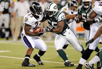 BALTIMORE - AUGUST 24:   Willis McGahee #23 of the Baltimore Ravens is tackled by Jamaal Westerman of the New York Jets during a preseason game at M&T Bank Stadium on August 24, 2009 in Baltimore, Maryland.  (Photo by Greg Fiume/Getty Images)