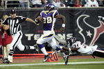 HOUSTON - AUGUST 31:  Running back Adrian Peterson #28 scores on a 75 yard run as strong safety Dominique Barber #34 of the Houston Texans makes a diving attempt to make the tackle at Reliant Stadium on August 31, 2009 in Houston, Texas.  (Photo by Bob Levey/Getty Images)