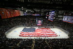 UNIONDALE, NY - OCTOBER 11: Pregame cermenoies before the St. Louis Blues took on the New York Islanders included youth hockey players holding an American flag during the national anthem on October 11, 2008 at the Nassau Coliseum in Uniondale, New York. (Photo by Bruce Bennett/Getty Images)