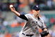 BALTIMORE - SEPTEMBER 01:  A.J. Burnett #34 of the New York Yankees pitches against the Baltimore Orioles at Camden Yards on September 1, 2009 in Baltimore, Maryland.  (Photo by Greg Fiume/Getty Images)