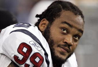 INDIANAPOLIS - SEPTEMBER 17:  Defensive tackle Travis Johnson #99 of the Houston Texans rests on the sidelines during the game against the Indianapolis Colts on September 17, 2006 at the RCA Dome in Indianapolis, Indiana. The Colts won 43-24.  (Photo by Brian Bahr/Getty Images)