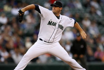 SEATTLE - AUGUST 25:  Starting pitcher Ryan Rowland-Smith #18 of the Seattle Mariners pitches against the Oakland Athletics on August 25, 2009 at Safeco Field in Seattle, Washington. (Photo by Otto Greule Jr/Getty Images)