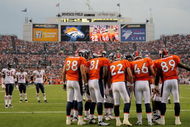 DENVER - AUGUST 30:  The Denver Broncos offensive huddles against the Chicago Bears during preseason NFL action at INVESCO Field at Mile High on August 30, 2009 in Denver, Colorado. The Bears defeated the Broncos 27-17.  (Photo by Doug Pensinger/Getty Images)
