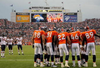 DENVER - AUGUST 30:  The Denver Broncos offensive huddles against the Chicago Bears during preseason NFL action at INVESCO Field at Mile High on August 30, 2009 in Denver, Colorado. The Bears defeated the Broncos 27-17.  (Photo by Doug Pensinger/Getty Images)