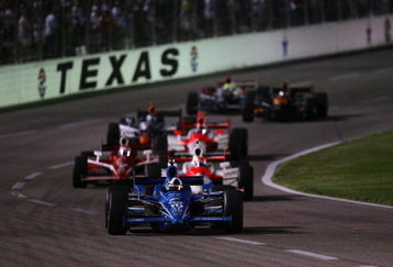 FORT WORTH, TX - JUNE 06:  Dario Franchitti, driver of the #10 Energizer Target Chip Ganassi Racing Dallara Honda, leads a group of cars during the IRL IndyCar Series Bombardier Learjet 550k on June 6, 2009 at Texas Motor Speedway in Fort Worth, Texas.  (Photo by Chris Trotman/Getty Images)