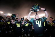 SAN DIEGO, CA - DECEMBER 30:  Daniel Padilla #41of the University of Oregon Ducks and teammates celebrate their 42-31 win over the Oklahoma State University Cowboys during the Pacific Life Holiday Bowl at Qualcomm Stadium on December 30, 2008 in San Diego, California. (Photo by Donald Miralle/Getty Images)