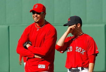 BOSTON - APRIL 24: Josh Beckett #19 and Dustin Pedroia #15 of the Boston Red Sox share a laugh before a game against the New York Yankees at Fenway Park, April 24, 2009, in Boston, Massachusetts. (Photo by Jim Rogash/Getty Images)
