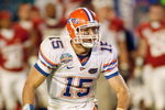 MIAMI - JANUARY 08:  Quarterback Tim Tebow #15 of the Florida Gators runs to pass the ball against the Oklahoma Sooners during the FedEx BCS National Championship Game at Dolphin Stadium on January 8, 2009 in Miami, Florida.  (Photo by Eliot J. Schechter/Getty Images