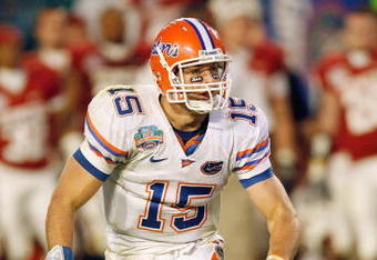 MIAMI - JANUARY 08:  Quarterback Tim Tebow #15 of the Florida Gators runs to pass the ball against the Oklahoma Sooners during the FedEx BCS National Championship Game at Dolphin Stadium on January 8, 2009 in Miami, Florida.  (Photo by Eliot J. Schechter/Getty Images