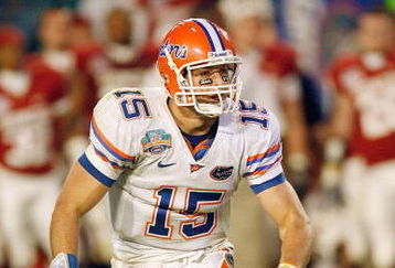 MIAMI - JANUARY 08:  Quarterback Tim Tebow #15 of the Florida Gators runs to pass the ball against the Oklahoma Sooners during the FedEx BCS National Championship Game at Dolphin Stadium on January 8, 2009 in Miami, Florida.  (Photo by Eliot J. Schechter/Getty Images