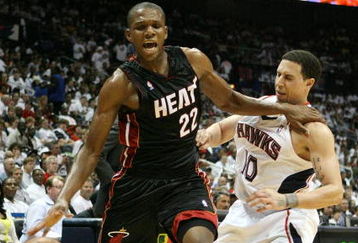 ATLANTA - APRIL 29:  James Jones #22 of the Miami Heat is fouled by Mike Bibby #10 of the Atlanta Hawks during Game Five of the Eastern Conference Quarterfinals at Philips Arena on April 29, 2009 in Atlanta, Georgia. NOTE TO USER: User expressly acknowledges and agrees that, by downloading and/or using this Photograph, user is consenting to the terms and conditions of the Getty Images License Agreement.  (Photo by Doug Benc/Getty Images)