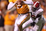 KNOXVILLE, TN - OCTOBER 25:  Nick Stephens #17 of the Tennessee Volunteers looks to pass the ball while pursued by Brandon Deaderick #95 of the Alabama Crimson Tide at Neyland Stadium on October 25, 2008 in Knoxville, Tennessee.  (Photo by Andy Lyons/Getty Images)