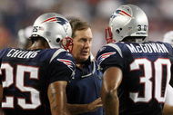 FOXBORO, MA - AUGUST 20:  Head coach Bill Belichick of the New England Patriots talks with Pat Chung #25 and Brandon McGowan #30 against the Cincinnati Bengals during their preseason game at Gillette Stadium on August 20, 2009 in Foxboro, Massachusetts.  (Photo by Jim Rogash/Getty Images)