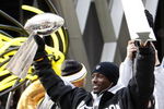 PITTSBURGH - FEBRUARY 03:  Santonio Holmes #10 of the Pittsburgh Steelers holds up his MVP and the Lombardi trophy after a parade to celebrate winning Super Bowl XLIII on February 3, 2009 in Pittsburgh, Pennsylvania.  (Photo by Gregory Shamus/Getty Images)