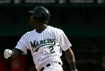 MIAMI - APRIL 06:  Hanley Ramirez #2 of the Florida Marlins drives in Emilio Bonifacio #1 with a double in the third inning against the Washington Nationals on opening day at Dolphin Stadium on April 6, 2009 in Miami, Florida.  (Photo by Doug Benc/Getty Images)