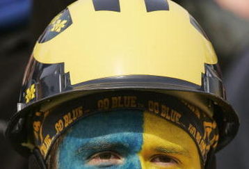 ANN ARBOR, MI - NOVEMBER 4:  A fan wears the school colors during the NCAA football game between the Ball State Cardinals and the Michigan Wolverines on November 4, 2006 at Michigan Stadium in Ann Arbor, Michigan. Michigan won 34-26. (Photo by Brian Bahr/Getty Images)