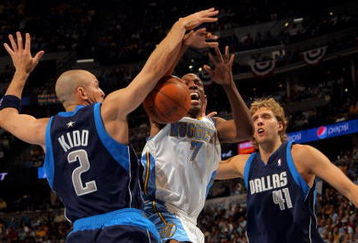 DENVER - MAY 13:  Chauncey Billups #7 of the Denver Nuggets has the ball knocked away by Jason Kidd #2 of the Dallas Mavericks as Dirk Nowitzki #41 looks on in Game Five of the Western Conference Semifinals during the 2009 NBA Playoffs at Pepsi Center on May 13, 2009 in Denver, Colorado. NOTE TO USER: User expressly acknowledges and agrees that, by downloading and or using this photograph, User is consenting to the terms and conditions of the Getty Images License Agreement.  (Photo by Doug Pensinger/Getty Images)