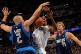 DENVER - MAY 13:  Chauncey Billups #7 of the Denver Nuggets has the ball knocked away by Jason Kidd #2 of the Dallas Mavericks as Dirk Nowitzki #41 looks on in Game Five of the Western Conference Semifinals during the 2009 NBA Playoffs at Pepsi Center on May 13, 2009 in Denver, Colorado. NOTE TO USER: User expressly acknowledges and agrees that, by downloading and or using this photograph, User is consenting to the terms and conditions of the Getty Images License Agreement.  (Photo by Doug Pensinger/Getty Images)