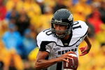 COLUMBIA, MO - SEPTEMBER 13:  Quarterback Colin Kaepernick #10 of the Nevada Wolf Pack rolls out during the first half of the game against the Missouri Tigers on September 13, 2008 at Memorial Stadium in Columbia, Missouri.  (Photo by Jamie Squire/Getty Images)