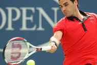 NEW YORK - AUGUST 31:  Roger Federer of Switzerland returns a shot against Devin Britton of the United States during day one of the 2009 U.S. Open at the USTA Billie Jean King National Tennis Center on August 31, 2009 in Flushing neighborhood of the Queens borough of New York City.  (Photo by Al Bello/Getty Images)