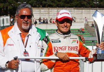 SPA FRANCORCHAMPS, BELGIUM - AUGUST 30:  Second placed Giancarlo Fisichella of Italy and Force India celebrates with his team owner Dr Vijay Mallya and team mates following the Belgian Grand Prix at the Circuit of Spa Francorchamps on August 30, 2009 in Spa Francorchamps, Belgium.  (Photo by Mark Thompson/Getty Images)