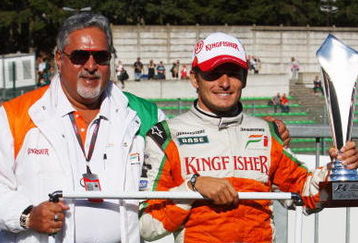 SPA FRANCORCHAMPS, BELGIUM - AUGUST 30:  Second placed Giancarlo Fisichella of Italy and Force India celebrates with his team owner Dr Vijay Mallya and team mates following the Belgian Grand Prix at the Circuit of Spa Francorchamps on August 30, 2009 in Spa Francorchamps, Belgium.  (Photo by Mark Thompson/Getty Images)